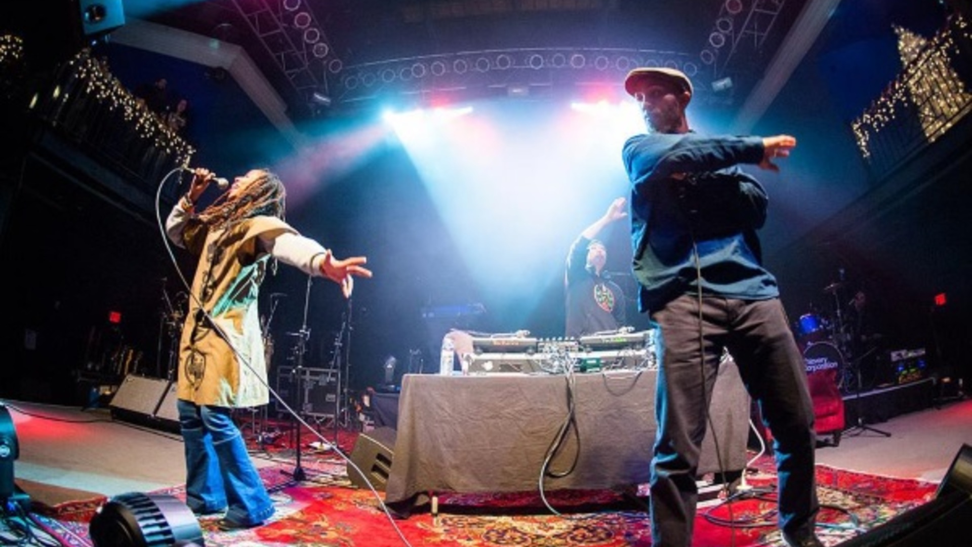 Small club rap show from crowd perspective with smoky atmosphere